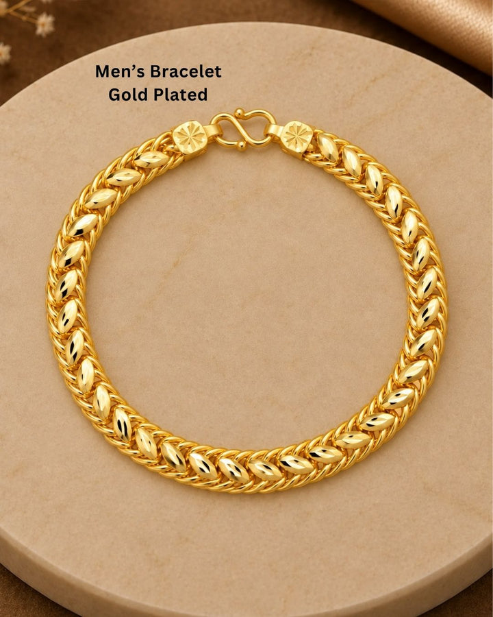 Beautiful gold plated bracelet featuring a repeating leaf pattern with detailed interwoven chain links and a classic hook clasp. Perfect for traditional wear, festive occasions, weddings, daily wear, and gifting.