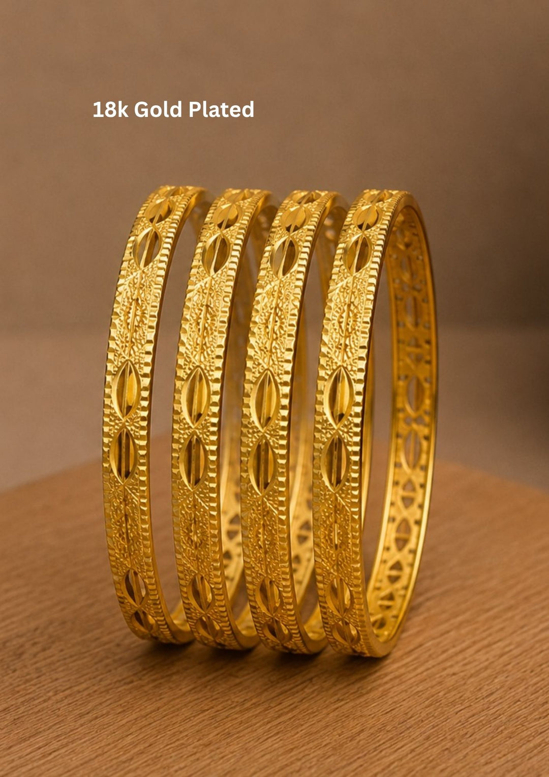 Premium designer gold plated bangles featuring intricate leaf-inspired carvings that blend timeless craftsmanship with everyday elegance.