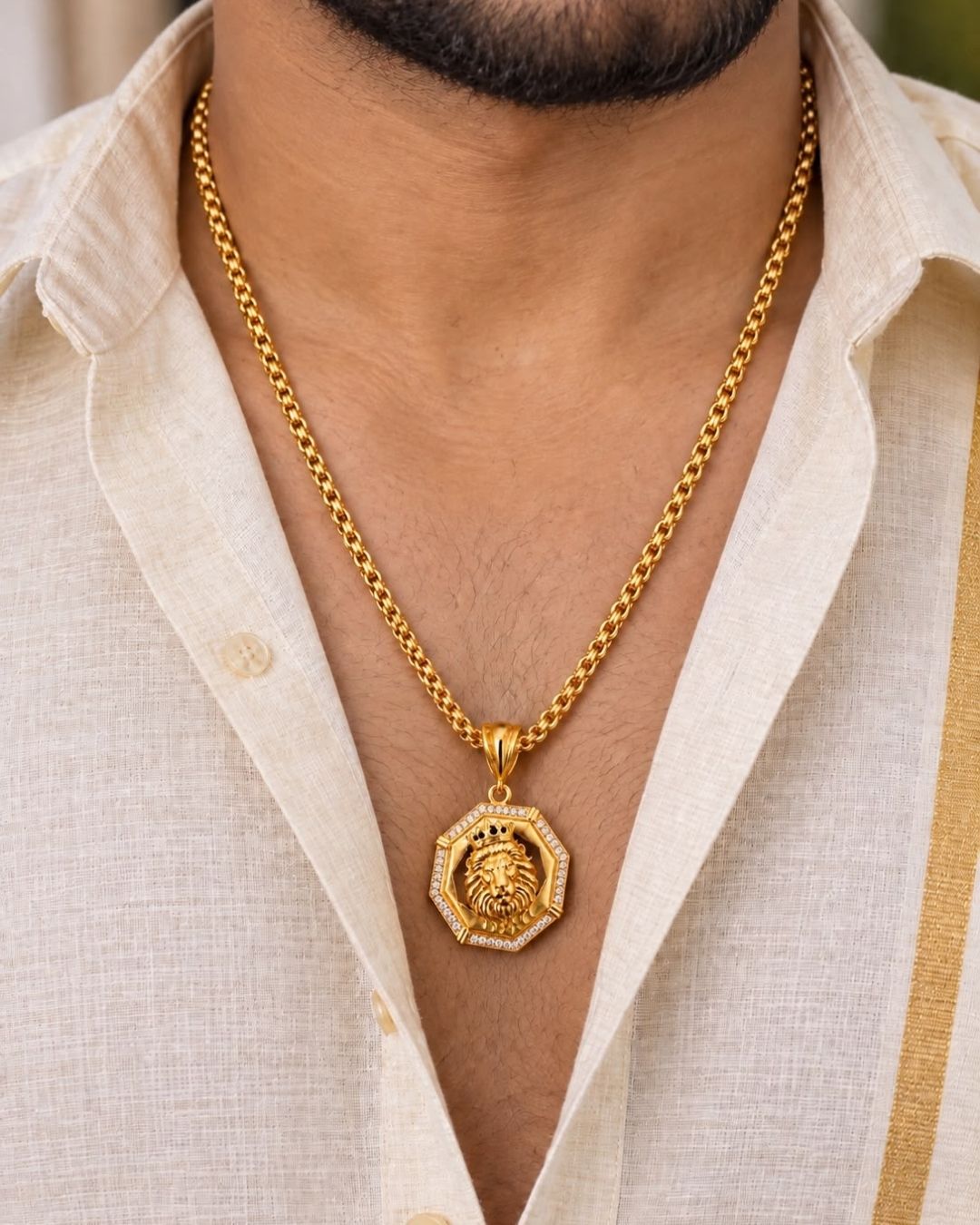 Bold gold plated lion pendant featuring an intricately detailed lion face, black center, octagonal gold frame, and sparkling stone border, perfect for men’s fashion, parties, festive occasions, and statement looks.