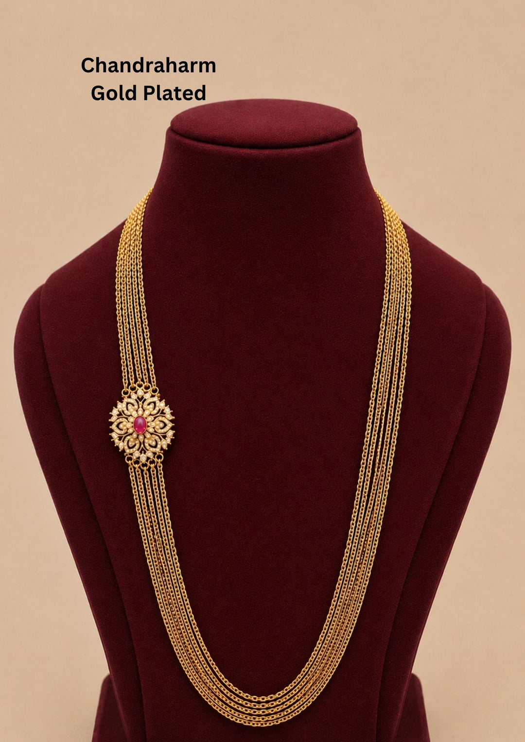 Elegant gold plated Chandraharam featuring multiple fine layered chains with a beautifully crafted floral side pendant accented by a ruby center stone. A graceful South Indian traditional necklace perfect for weddings, bridal wear, and festive celebrations.