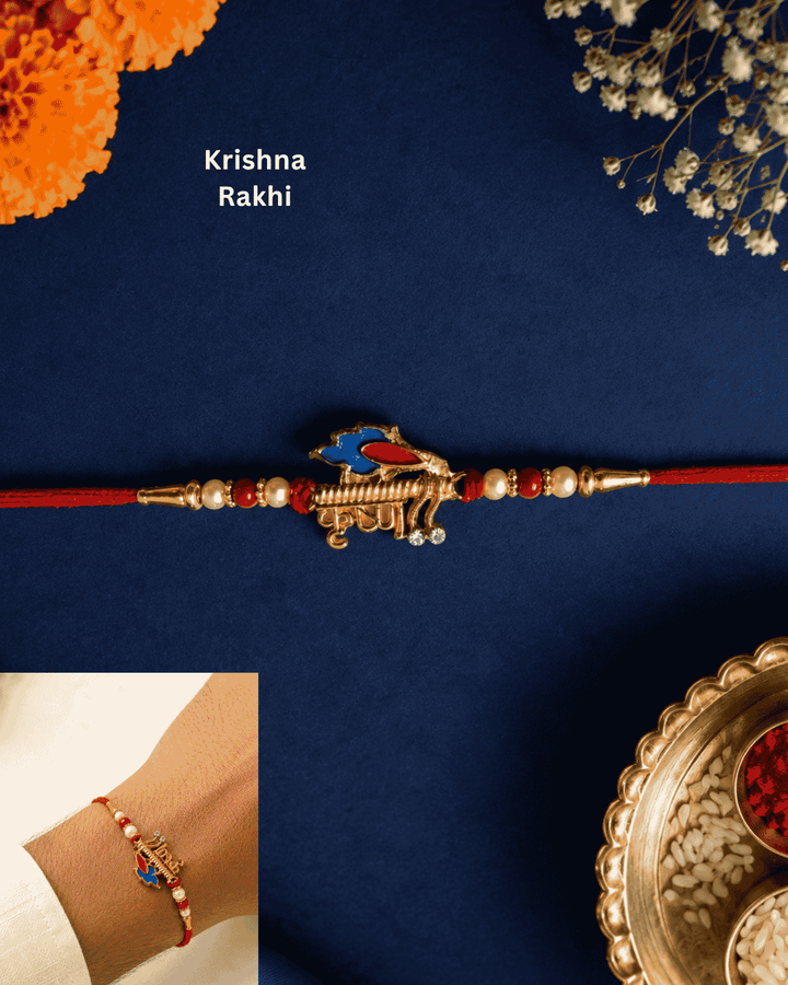 Premium Krishna Flute Rakhi with gold plated finish, peacock feather enamel charm, pearl accents, and red thread, perfect for Raksha Bandhan celebrations.