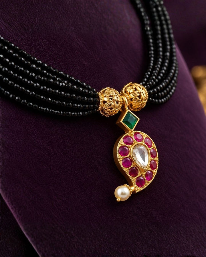 Jadau Kundan Gold Plated Mangalsutra design with traditional black bead chain, mango pendant design, kundan stone detailing, antique gold plated finish, lightweight and perfect for daily wear , pooja functions, festivals, and wedding wear.