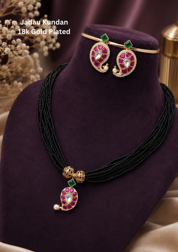 Detailed close-up view of the daily wear 18k gold plated American diamond mangalsutra set. The skin-friendly, anti-fade light mangalsutra chain and stud earrings offer a minimalist traditional look that pairs perfectly with modern western formal shirts, daily wear kurtis, and festive outfits.