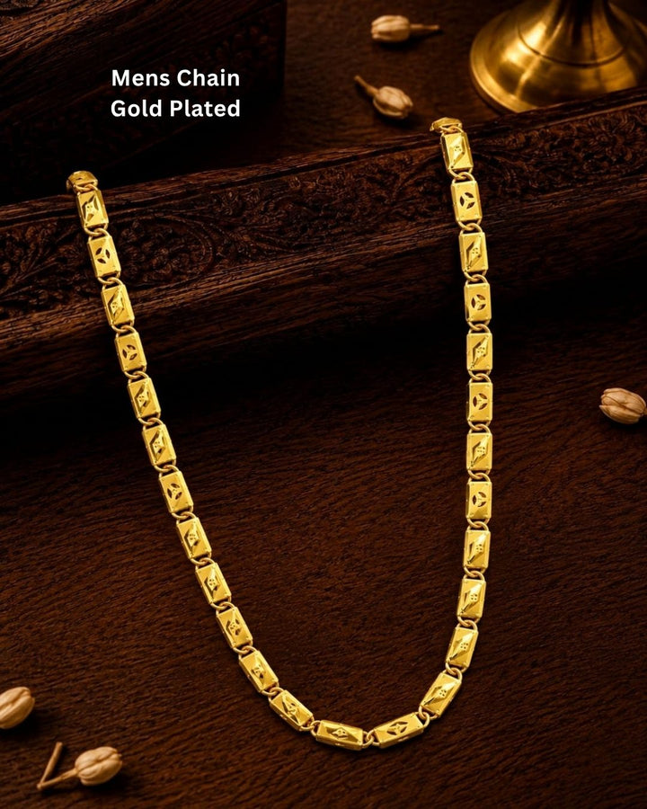Elegant gold plated men’s designer chain featuring repeating rectangular links with geometric cutwork patterns and a bold polished finish, suitable for traditional and modern wear.