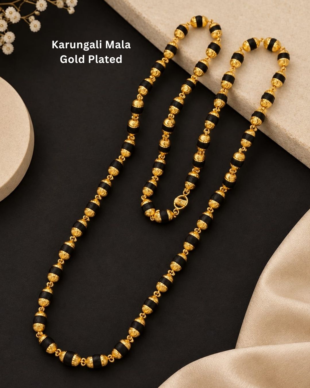 Elegant gold plated men’s Rudraksha mala featuring alternating black beads and detailed gold accents, designed for a traditional and spiritual look.