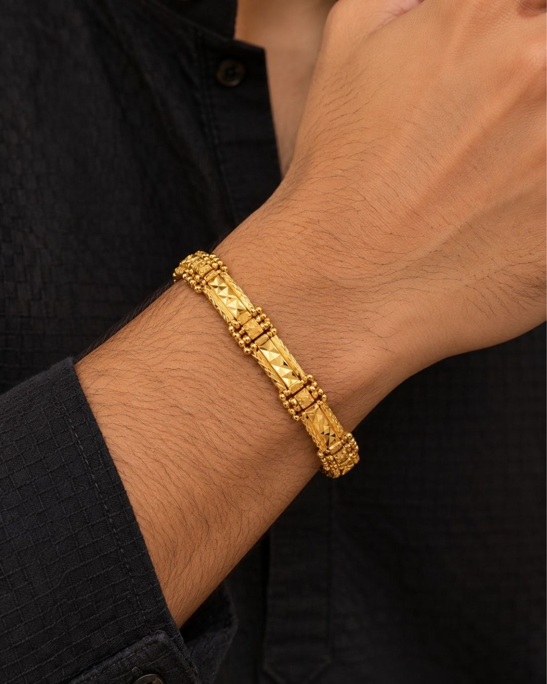 Elegant gold plated men’s designer bracelet featuring detailed rectangular links, geometric patterns, and a classic polished finish, perfect for traditional and modern wear.