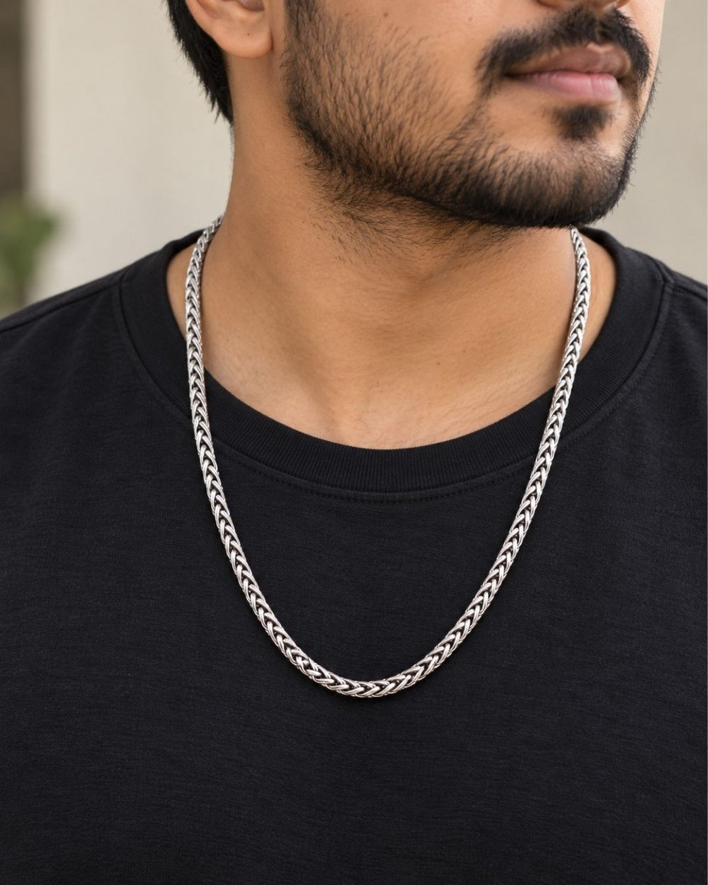 Elegant silver plated men’s necklace with a bold braided chain pattern, polished finish, and modern look.