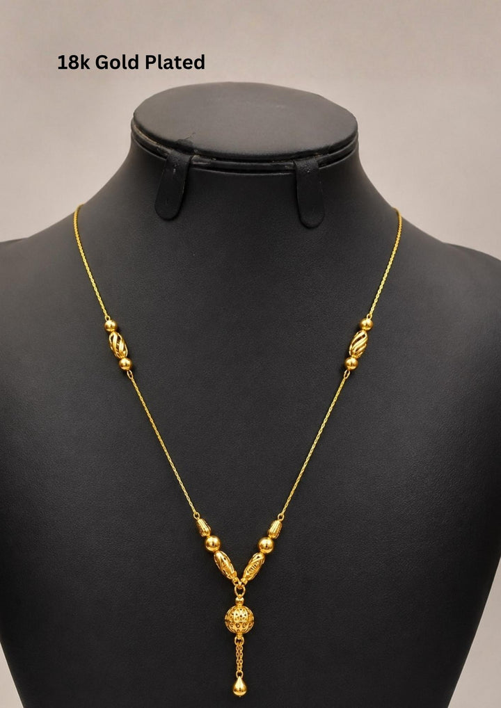 Elegant 18K gold plated necklace featuring textured designer beads and a beautifully crafted spherical drop pendant with a delicate dangling charm. Lightweight and ideal for everyday elegance.