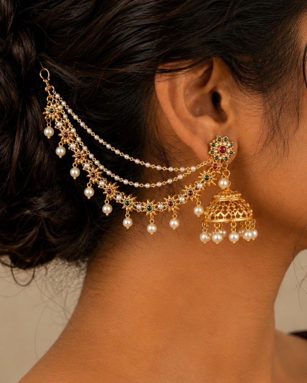 Beautiful gold plated Champaswaralu featuring floral motifs with green and red stone accents and multiple pearl drops. Perfect for traditional outfits, festive occasions, temple events, and special celebrations.