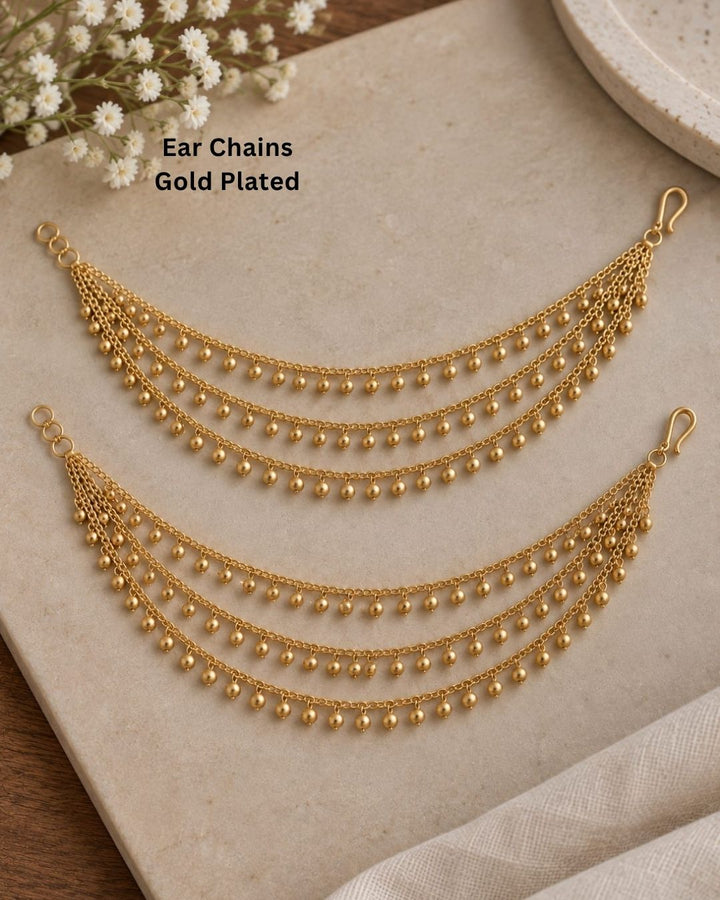 Elegant gold plated multi-layer waist chain featuring delicate dangling beads, designed to complement sarees, lehengas, and bridal attire.