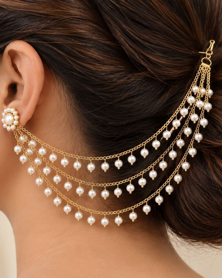 Gold-plated multi-strand chain ear chains decorated with small white pearl-like beads, displayed on a dark navy blue background with the text &