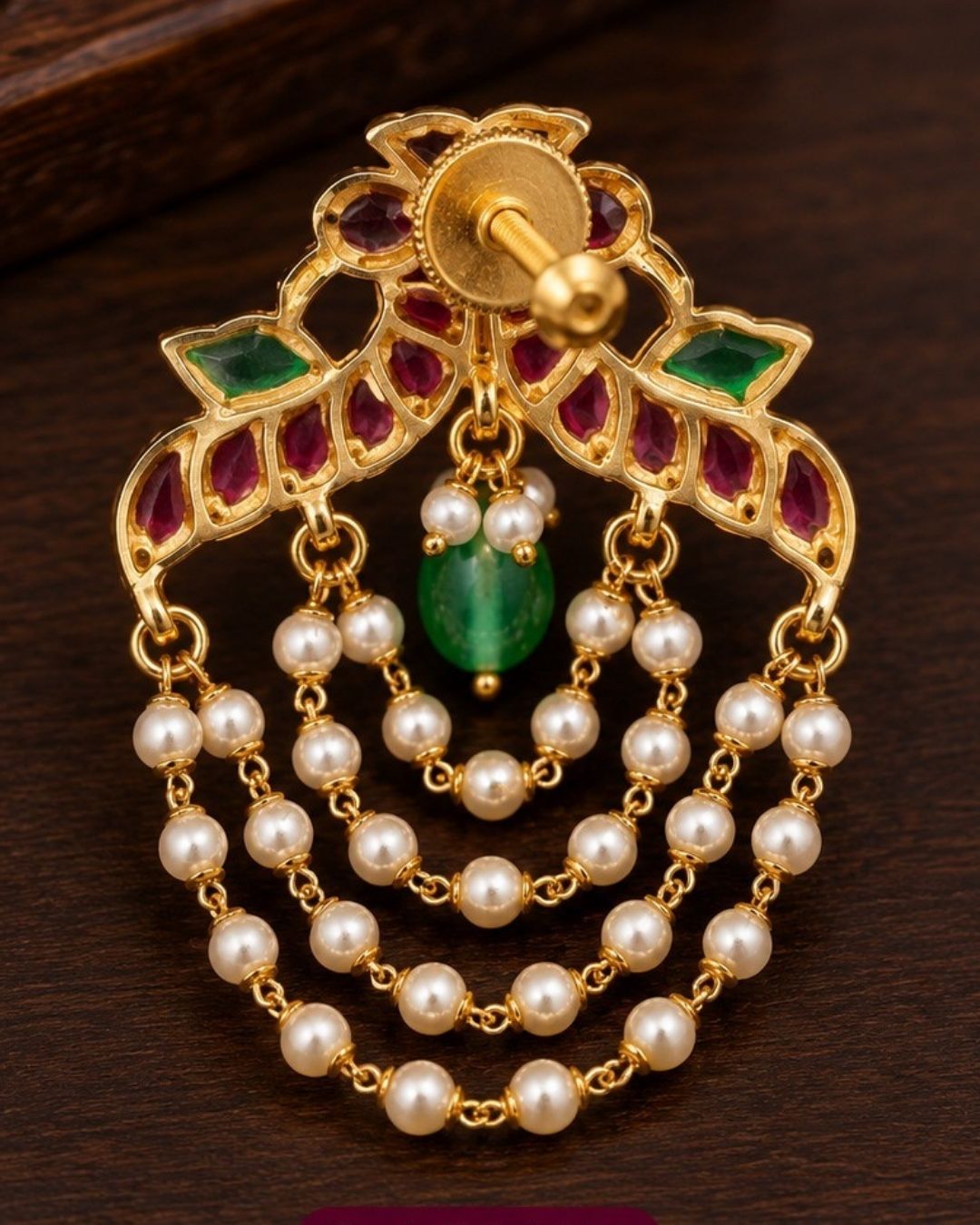 Traditional style gold plated Jadau crescent chandbali earrings designed with screwback stems, vibrant pink-green stone layouts, and four hanging layers of micro pearl chains that give a graceful traditional look for festive celebrations, poojas, family functions, and bridal outfits.