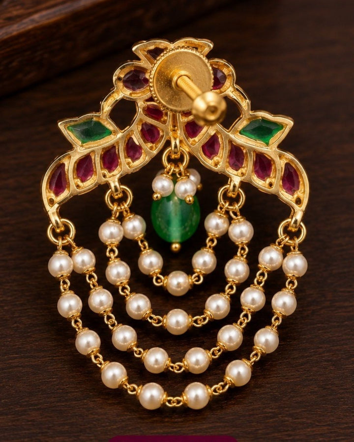 Traditional style gold plated Jadau crescent chandbali earrings designed with screwback stems, vibrant pink-green stone layouts, and four hanging layers of micro pearl chains that give a graceful traditional look for festive celebrations, poojas, family functions, and bridal outfits.