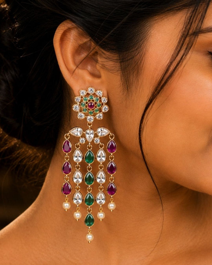 South Indian woman wearing lightweight zircon earrings showing minimal festive jewellery look with elegant shine and daily wear comfort.