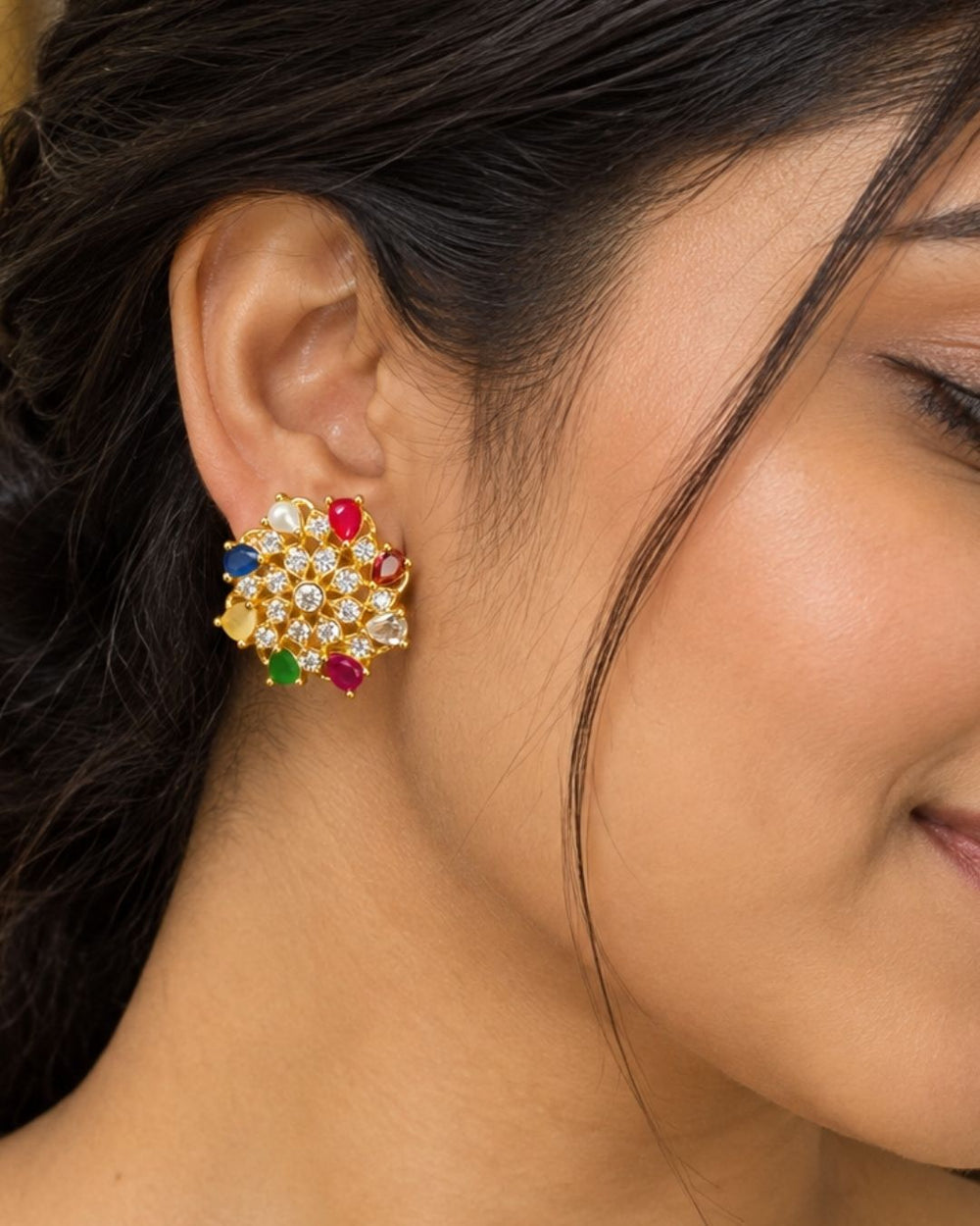 Beautiful gold plated floral earrings featuring a lustrous pearl center, colorful petal-shaped stones, and sparkling crystal accents, perfect for festive occasions, parties, weddings, and traditional looks.