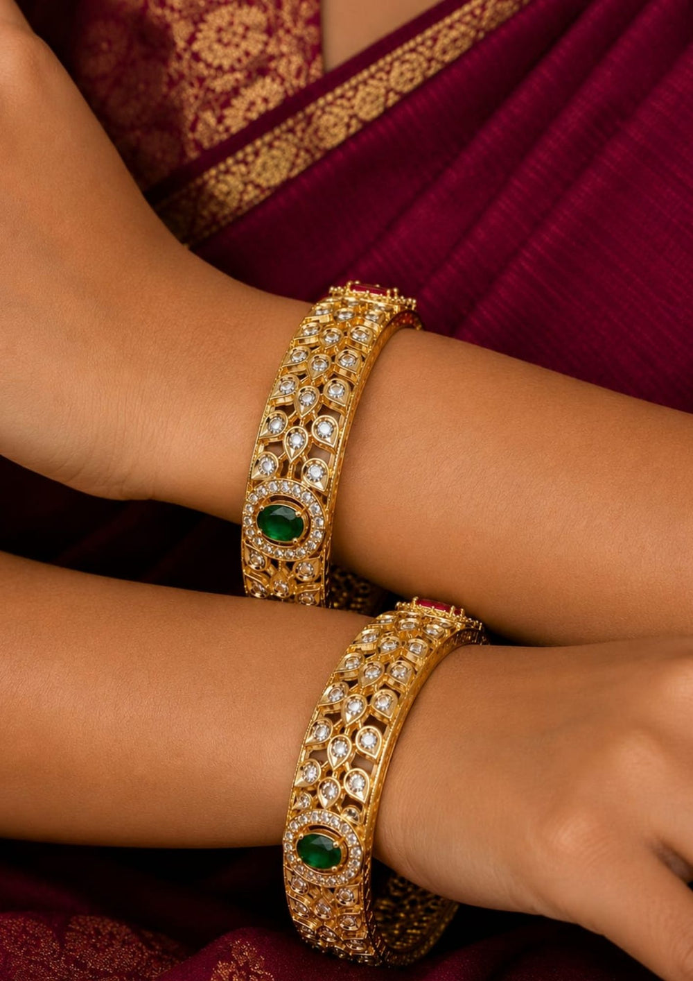 South indian women's Beautiful Jadau Kundan gold plated openwork bangle pair featuring dazzling white kundan stones, emerald green center stones, and intricate traditional craftsmanship. Perfect for weddings, festivals, temple visits, traditional outfits, family functions, and premium gifting.