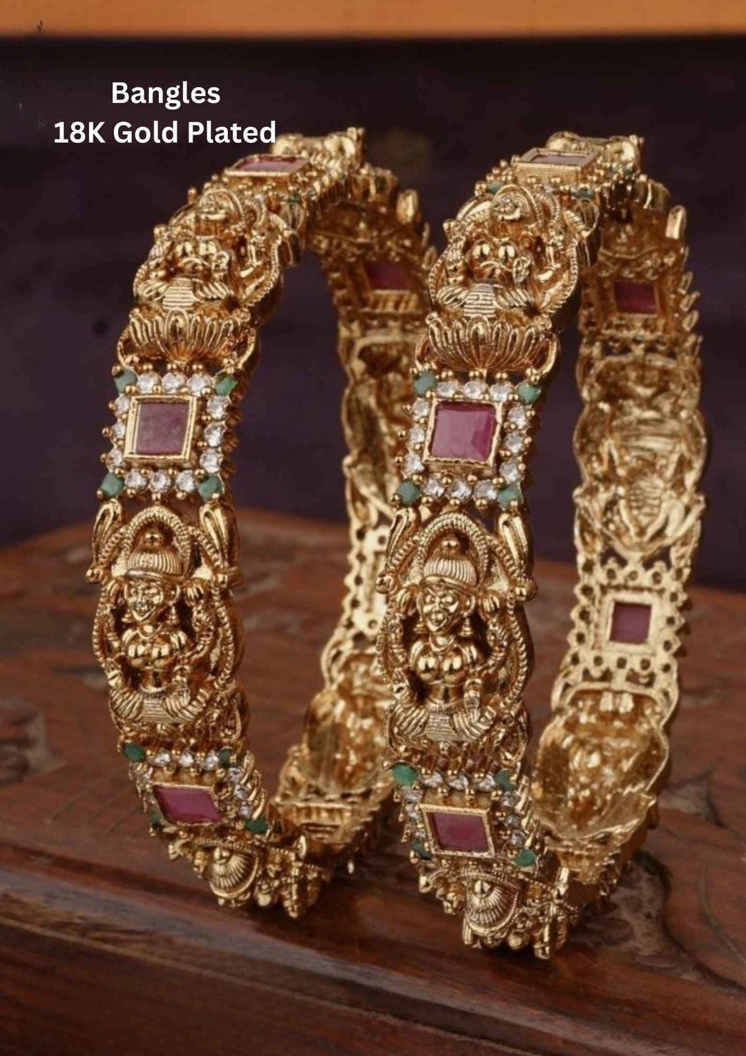 Pair of gold-plated bangles with gemstones