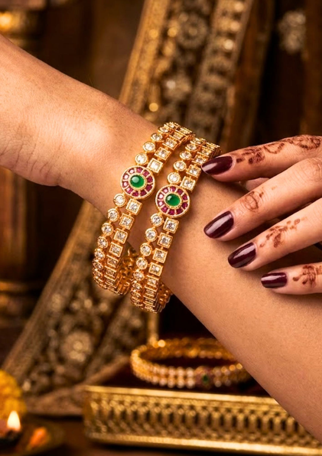 south indian women wearings a traditional  Panchaloham  bangles with shine and good looking and used for  functional , festivals and gifting