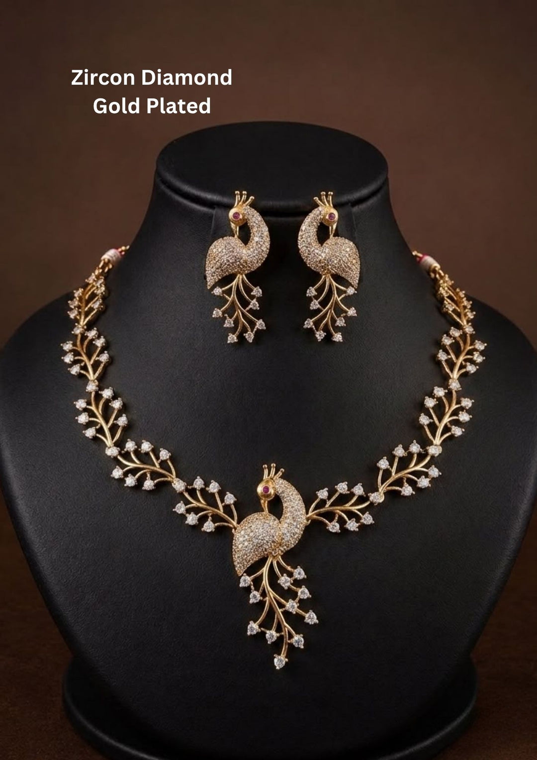 Premium peacock-inspired necklace set crafted with shimmering zircon stones and matching earrings. Beautiful zircon diamond gold plated peacock necklace set featuring elegant leaf patterns, sparkling zircon stones, and matching peacock earrings. Perfect for weddings, receptions, festive occasions, and party wear.