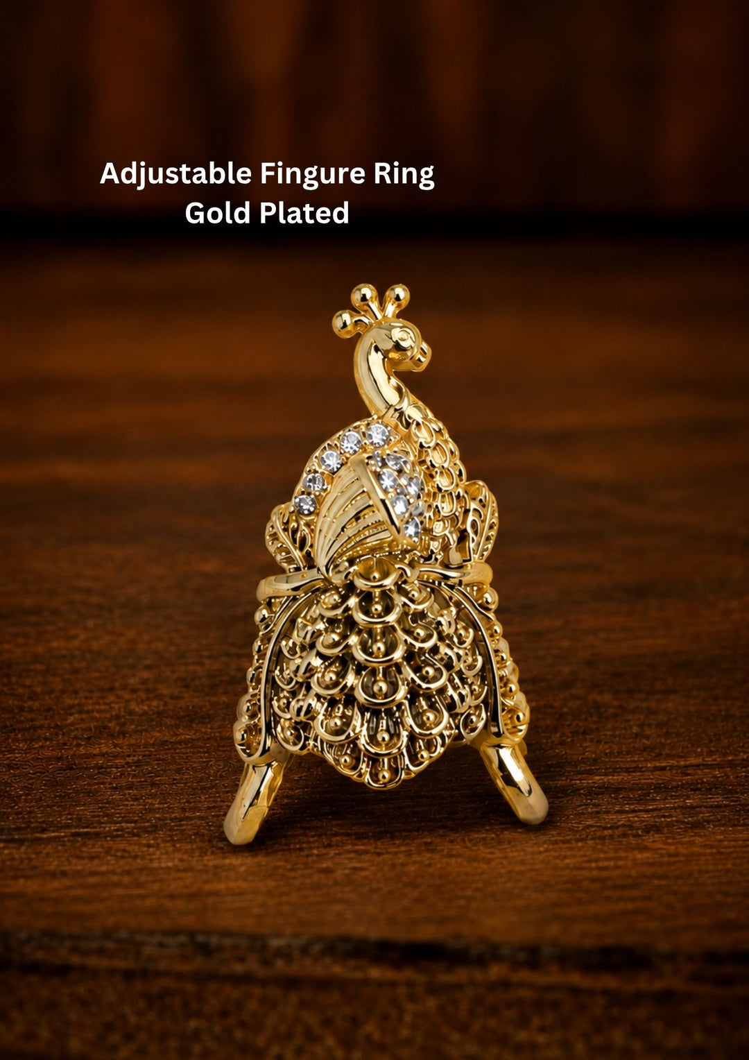 Premium peacock design adjustable finger ring crafted with fine gold plating and shimmering zircon detailing, ideal for weddings, parties, and ethnic celebrations.