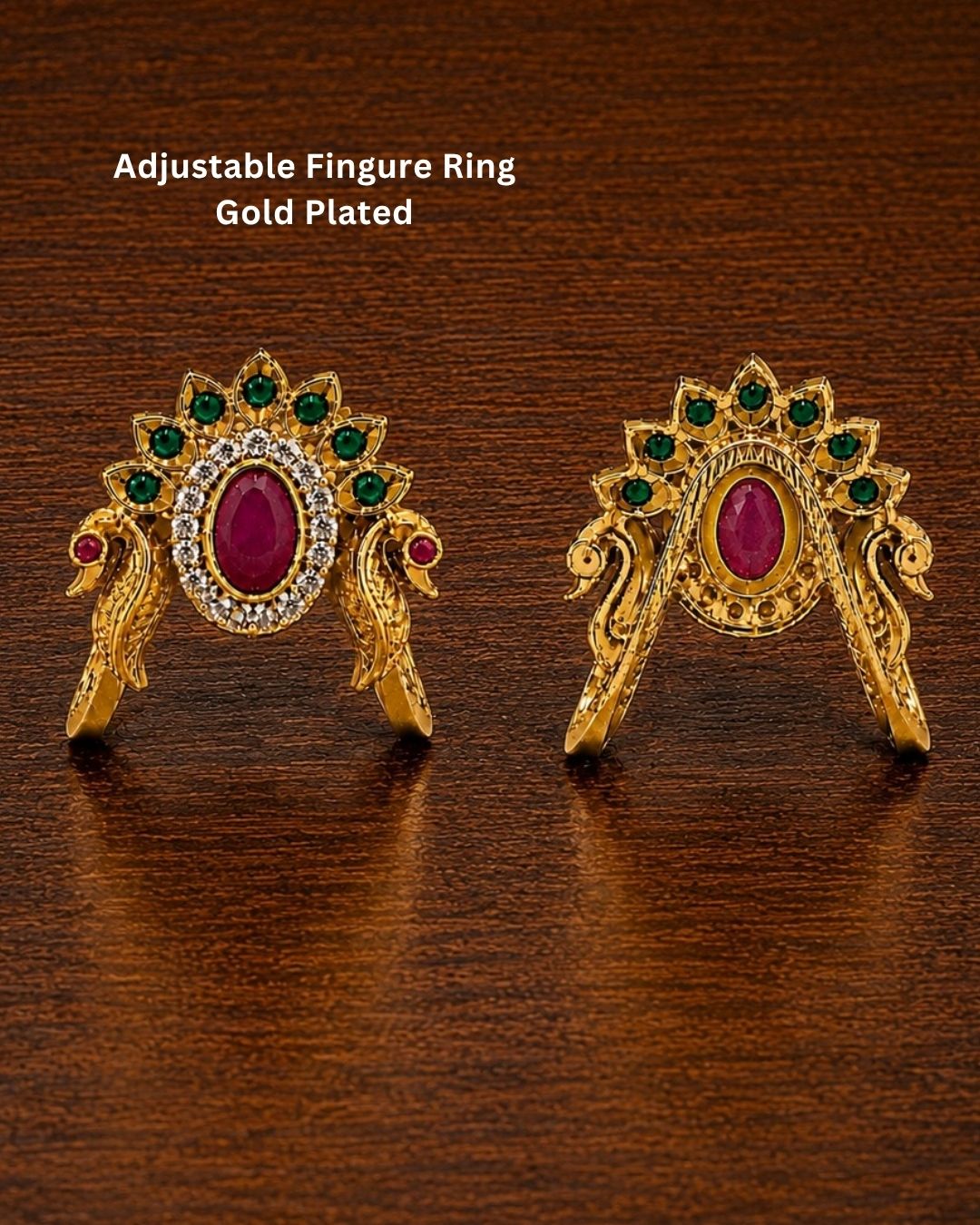Beautiful peacock design gold plated ring featuring a prominent ruby-colored center stone, surrounding green stones, and sparkling accents. Perfect for festive occasions, traditional outfits, parties, and gifting.