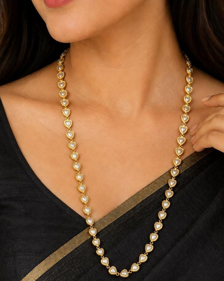 Stylish heart design gold plated chain featuring multiple heart-shaped pearl accents and delicate gold links. Perfect for daily wear, festive occasions, traditional outfits, gifting, and special occasions.
