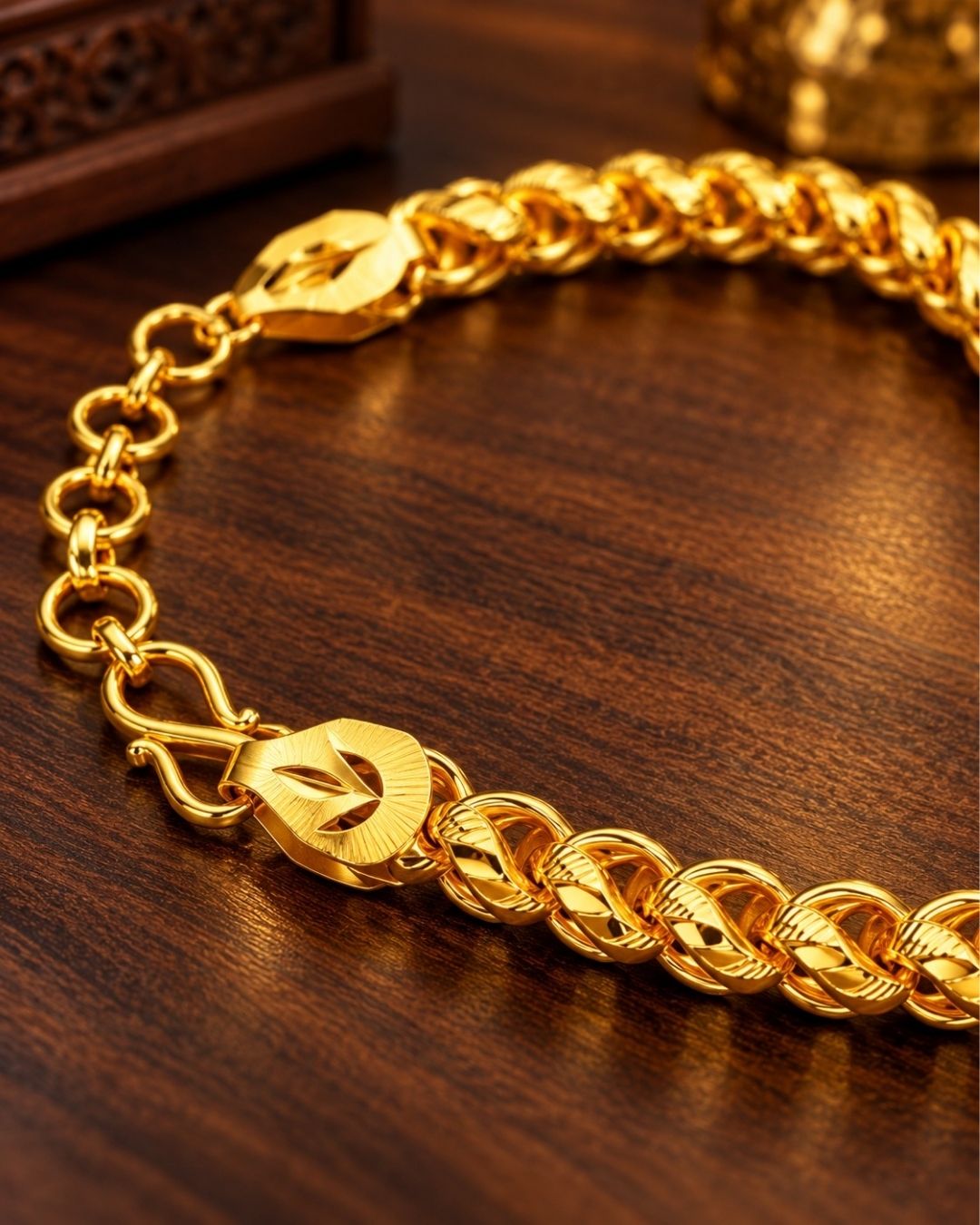 A close-up of a south indian man wrist wearing Elegant gold plated bracelet for men crafted with polished curb links and an adjustable clasp, perfect for daily wear, parties, traditional outfits, and gifting.