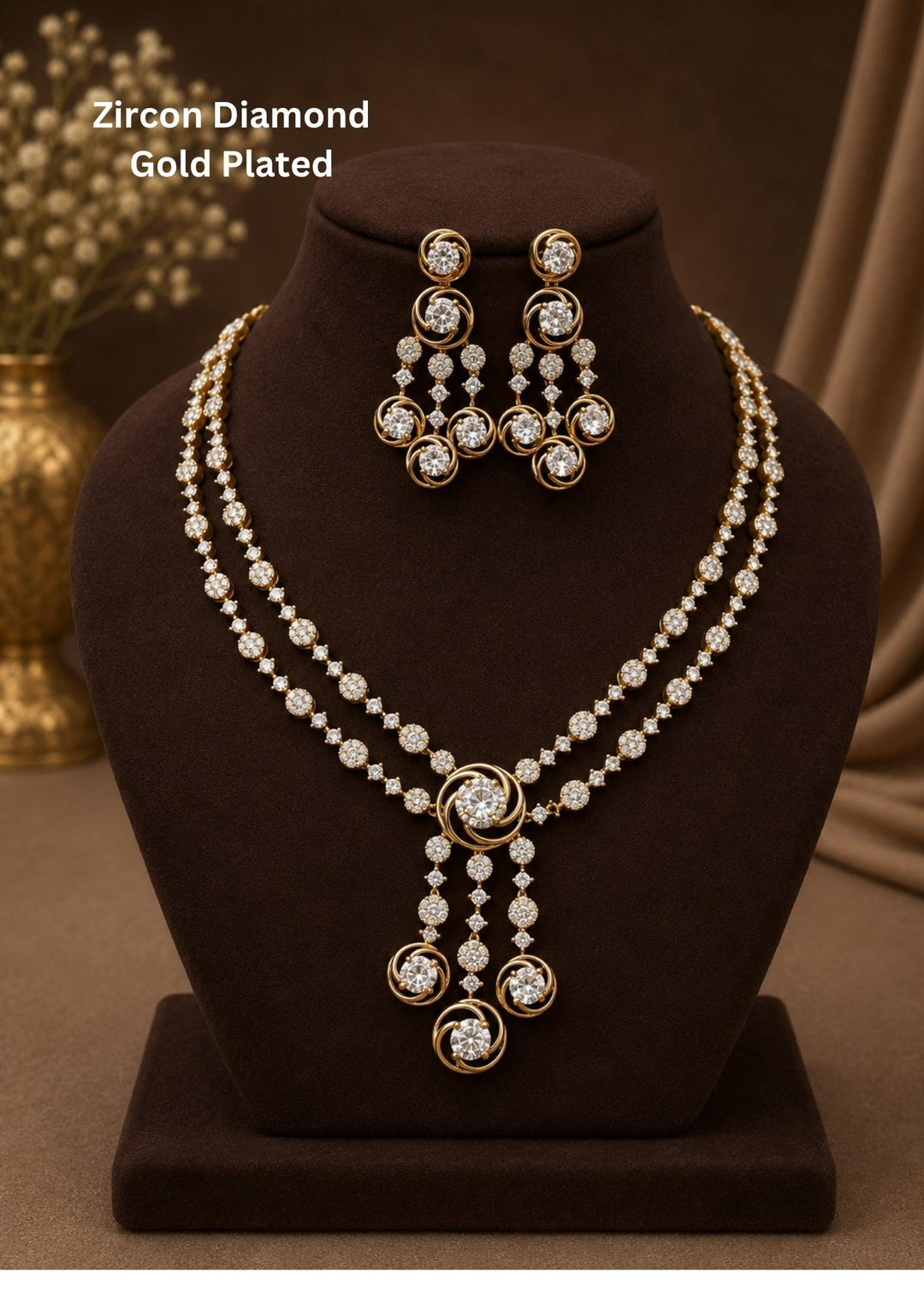 Gold plated two-layer necklace and matching hanging earrings set featuring two lines of small, round white stones. The chains join at a central round flower motif, from which three delicate lines of white stones hang down, each ending in a small circle design. The set features a clean layout suitable for festivals, family parties, and traditional celebrations.