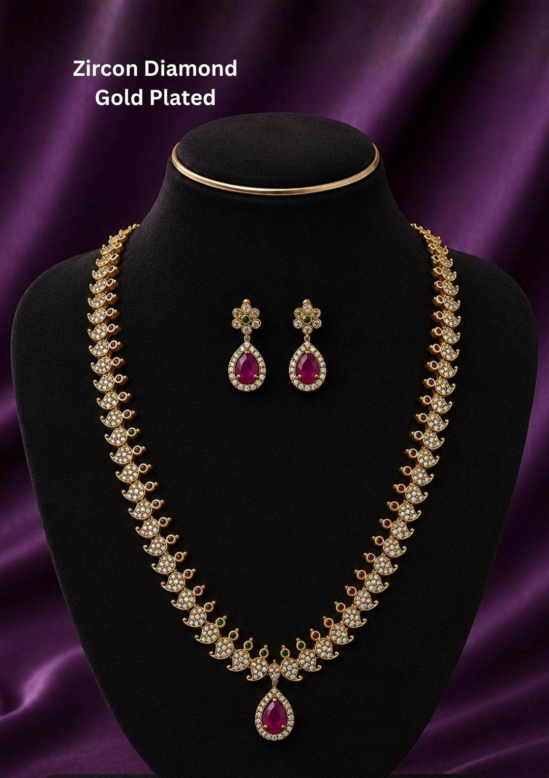 Gold-plated traditional Indian jewelry set featuring a necklace and matching earrings with pink teardrop-shaped stones and clear stones Premium gold plated long haram featuring sparkling zircon stones with ruby and emerald accents, paired with matching earrings.