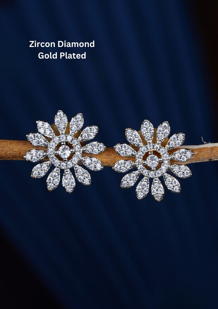 Elegant floral stud earrings crafted with dazzling zircon stones arranged in a blooming flower pattern. The diamond-look finish creates exceptional brilliance, making these studs suitable for daily wear and special occasions.