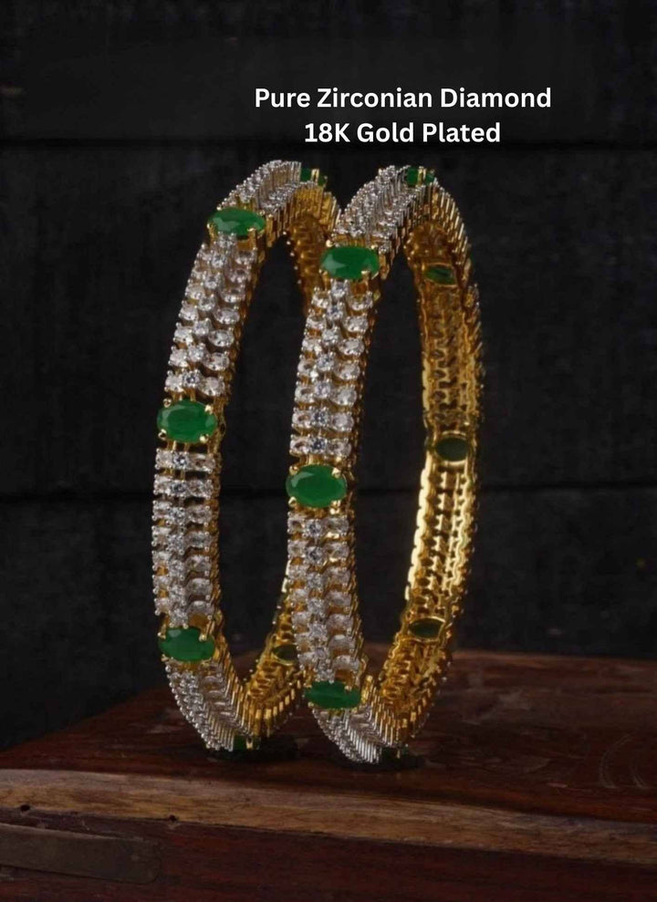Gold-plated hoop earrings with green gemstones 