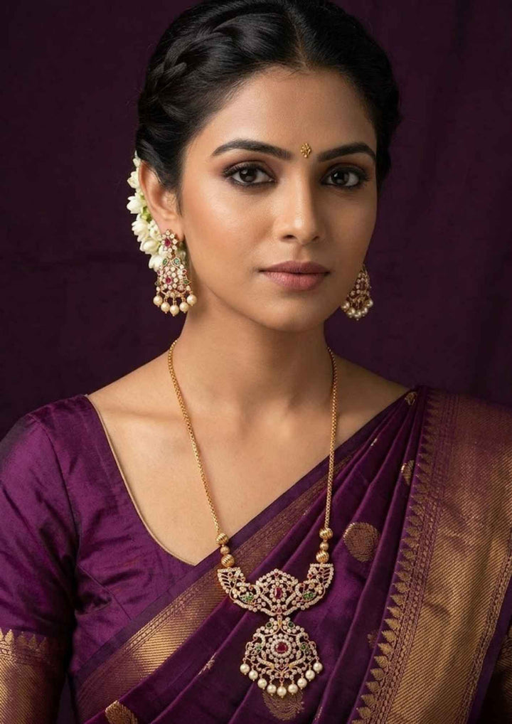 close-up of soyj indian women waering Gold Plated Zircon Diamond necklace and earring set showing the fine leaf link pattern and smooth pearl charms. This lightweight, sweat-proof jewelry piece offers an anti-fade, high-shine finish perfect for weddings, parties, and festive occasions.