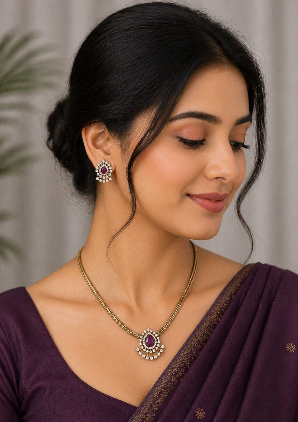 South indian women wearing a pure Zircon diamond gold plated pink ruby teardrop pendant set showing a flat golden chain and matching studs that give a graceful traditional and modern look for daily wear and office gifting with COD.