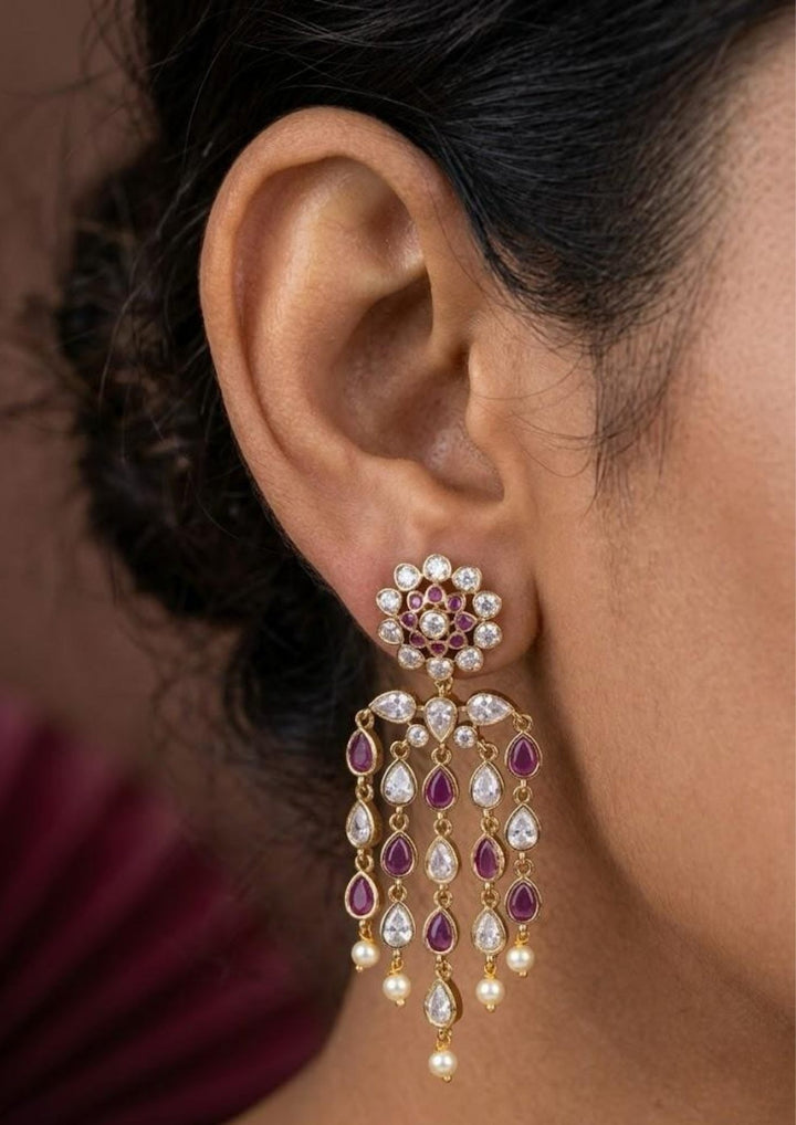 South Indian woman wearing lightweight zircon earrings showing minimal festive jewellery look with elegant shine and daily wear comfort.