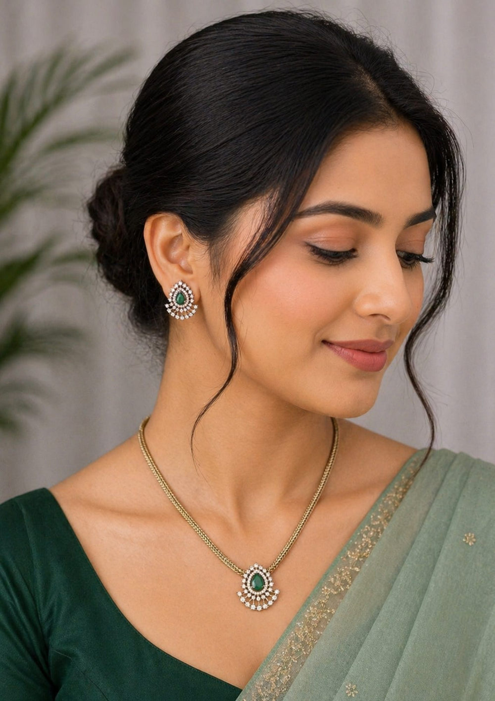 South indian women wearing a pure Zircon diamond 18k gold plated ruby teardrop pendant set showing a flat golden chain and matching studs that give a graceful traditional and modern look for daily wear and office gifting with COD.