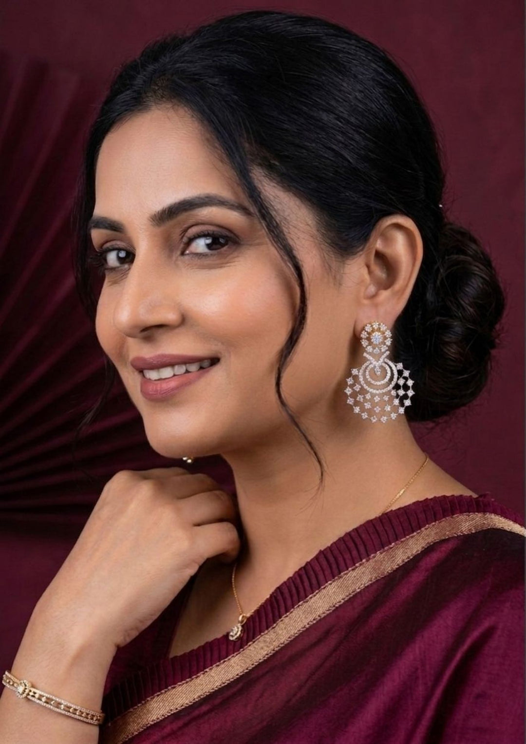 south Indian Woman wearing a chandbali earrings looking very shine and can see how women can look if we wear this earrings can be  used for functional ware, weeding , and can gift 