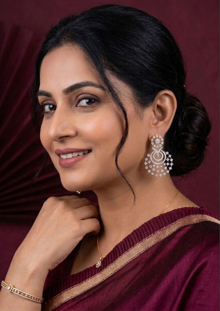 south Indian Woman wearing a chandbali earrings looking very shine and can see how women can look if we wear this earrings can be  used for functional ware, weeding , and can gift 