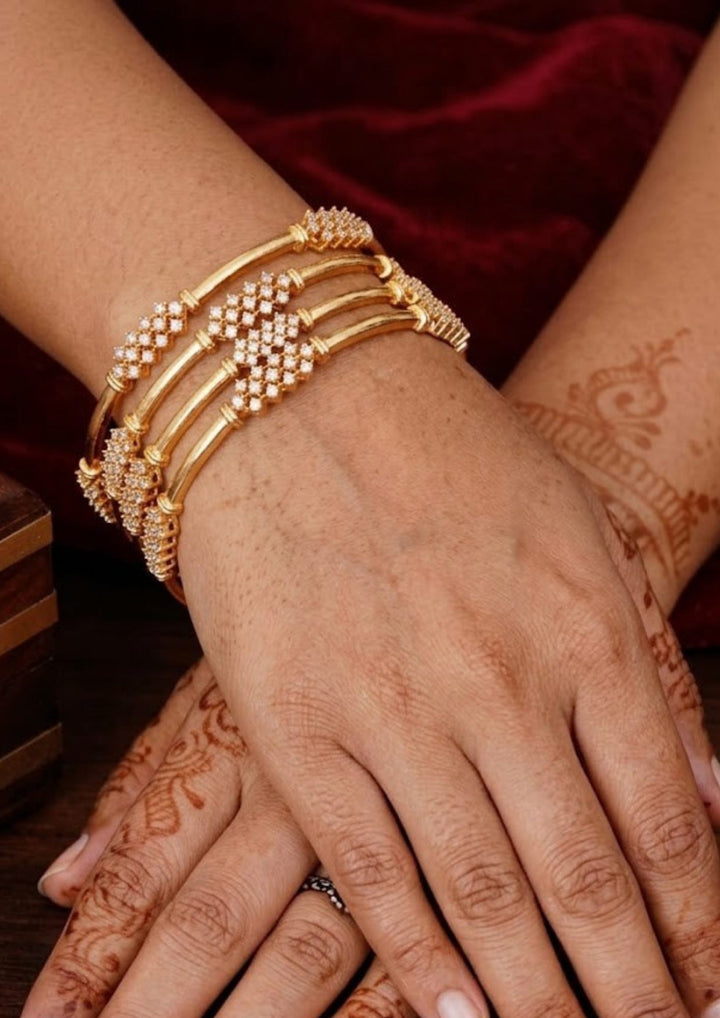 Pure Zirconian Diamond Gold Plated Floral Finish Bangles ( set of 4 )  Model Pic