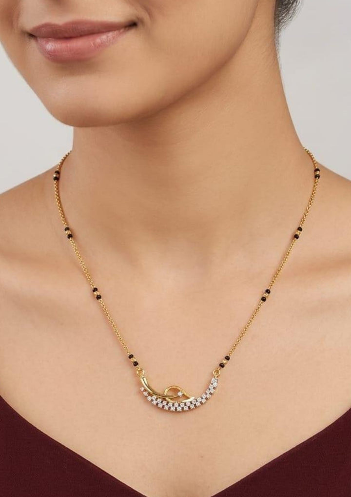 Pure Zirconian Diamond Gold Plated Leaf Mangalsutra Model Pic of modern women wearind ideal for Modern look