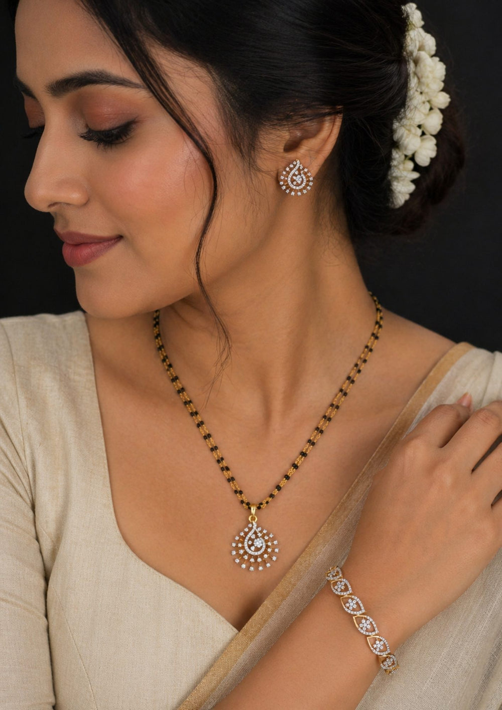 south indian Woman wearing gold plated bridal mangalsutra combo set. The main double-strand black bead necklace features an openwork swirling teardrop pendant densely paved with pure Zirconian diamonds. The matching set includes a pair of teardrop earrings, a coordinate statement ring, an adjustable sliding leaf bracelet, and a rigid round bangle.