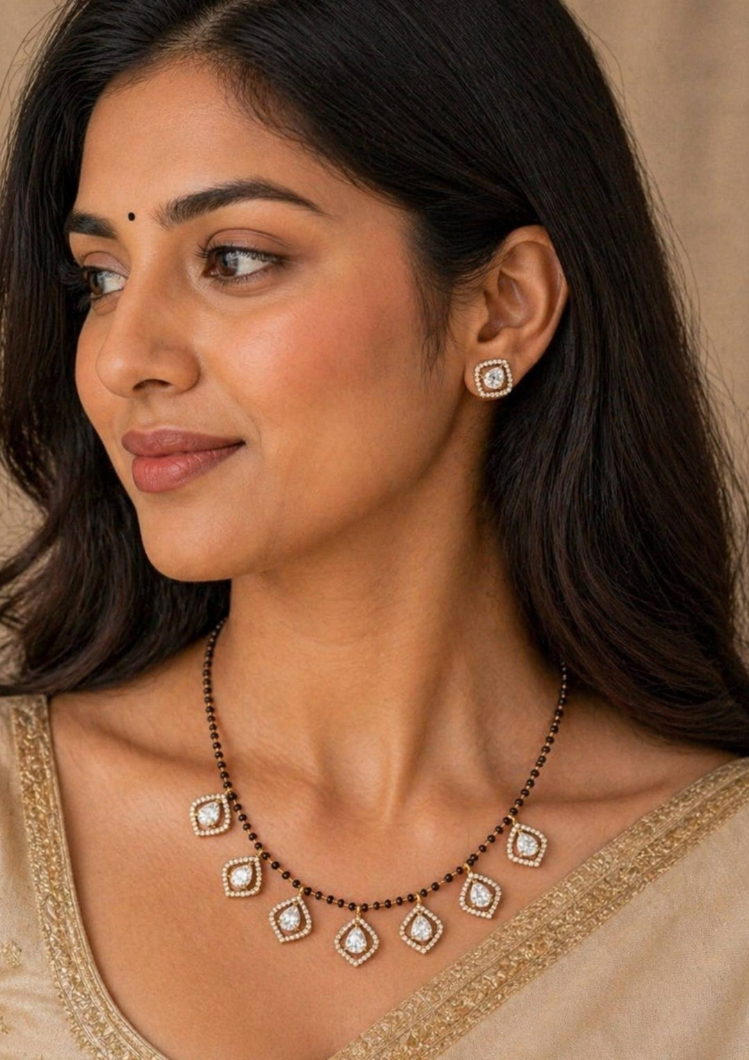 South Indian women styling 18k gold plated American diamond short mangalsutra set designed with modern multi-pendant CZ charms and traditional black beads that gives a graceful traditional and modern look for daily fashion wear, office styling, festive occasions, poojas, family functions and casual outfits with lightweight comfortable use and COD available now.
Meta Description: Buy Zircon Diamond 18k Gold Plated Short Mangalsutra Set with modern CZ stone charms and traditional black beads. Perfect for dail