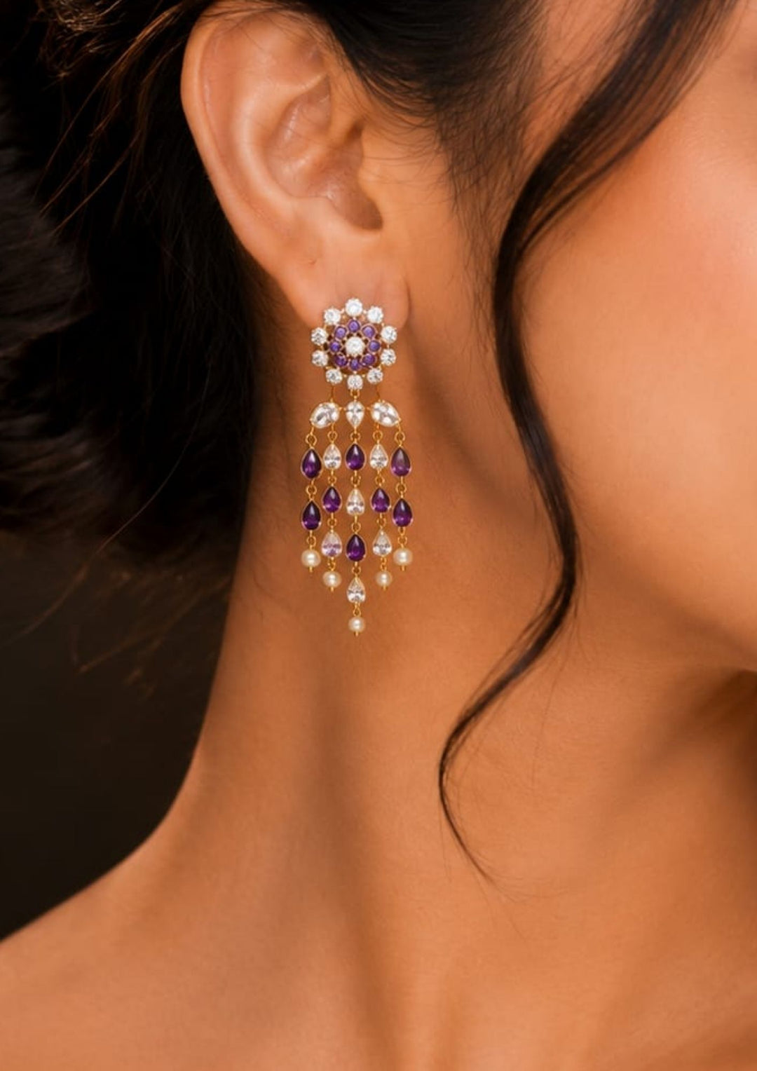 South Indian woman wearing lightweight zircon earrings showing minimal festive jewellery look with elegant shine and daily wear comfort.