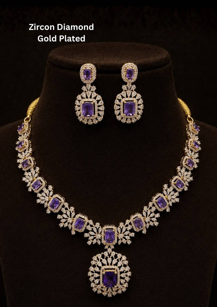 Beautiful necklace set crafted with brilliant purple zircon stones and sparkling diamond-like zircon detailing in a premium gold plated finish.
Includes matching statement earrings for a coordinated elegant look.
Perfect for weddings, receptions, parties, festive celebrations, and evening occasions.