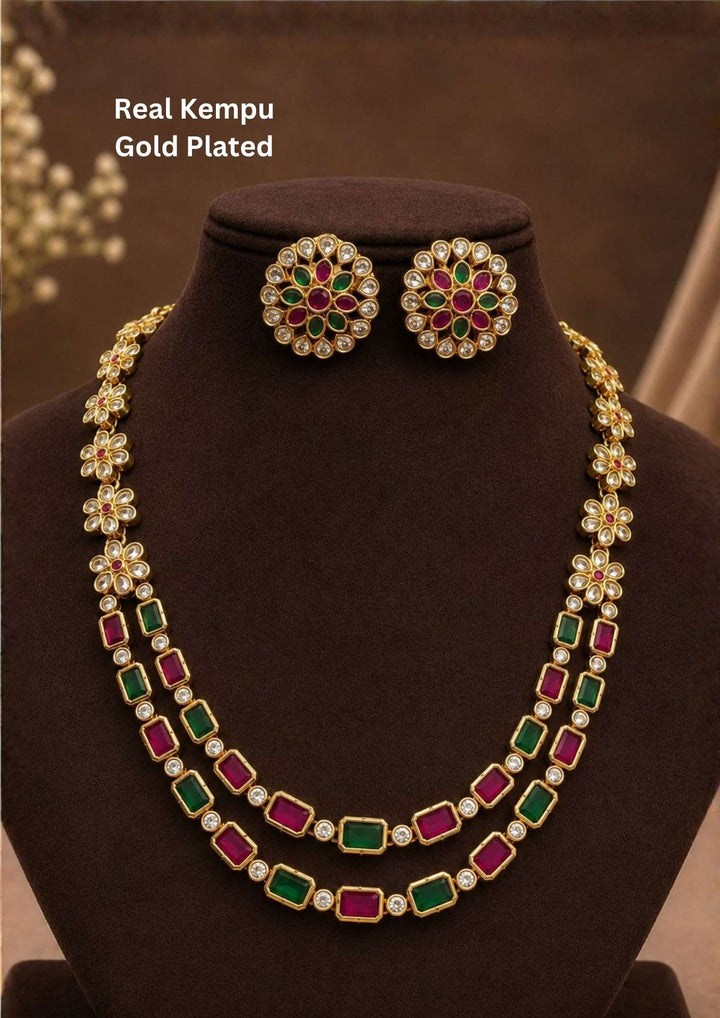 Beautiful real Kempu gold plated necklace set with a dual-layer design, floral motifs, ruby and green stones, brilliant white CZ accents, and matching earrings. Perfect for weddings, festivals, temple visits, traditional outfits, family functions, and premium gifting.