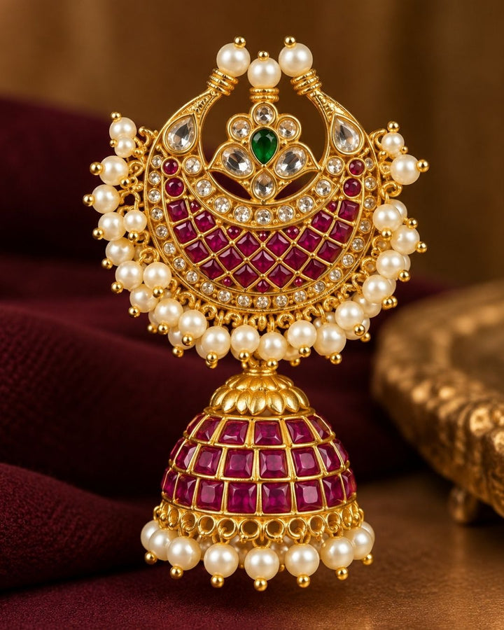 South Indian women wearing a  Close-up of traditional earring which shows how women will look and used real kempu in earrings and can be used for traditional wear and it is sweat proof and also lightweight jhumkas