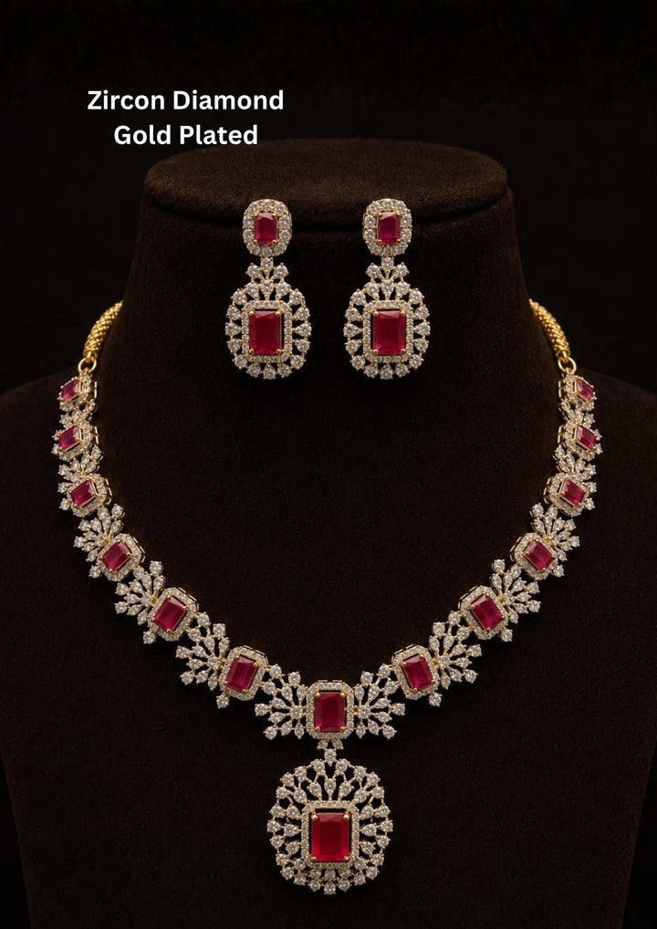 Beautiful necklace set crafted with brilliant red zircon stones and sparkling diamond-like zircon detailing in a premium gold plated finish.
Includes matching statement earrings for a coordinated elegant look.
Perfect for weddings, receptions, parties, festive celebrations, and evening occasions.