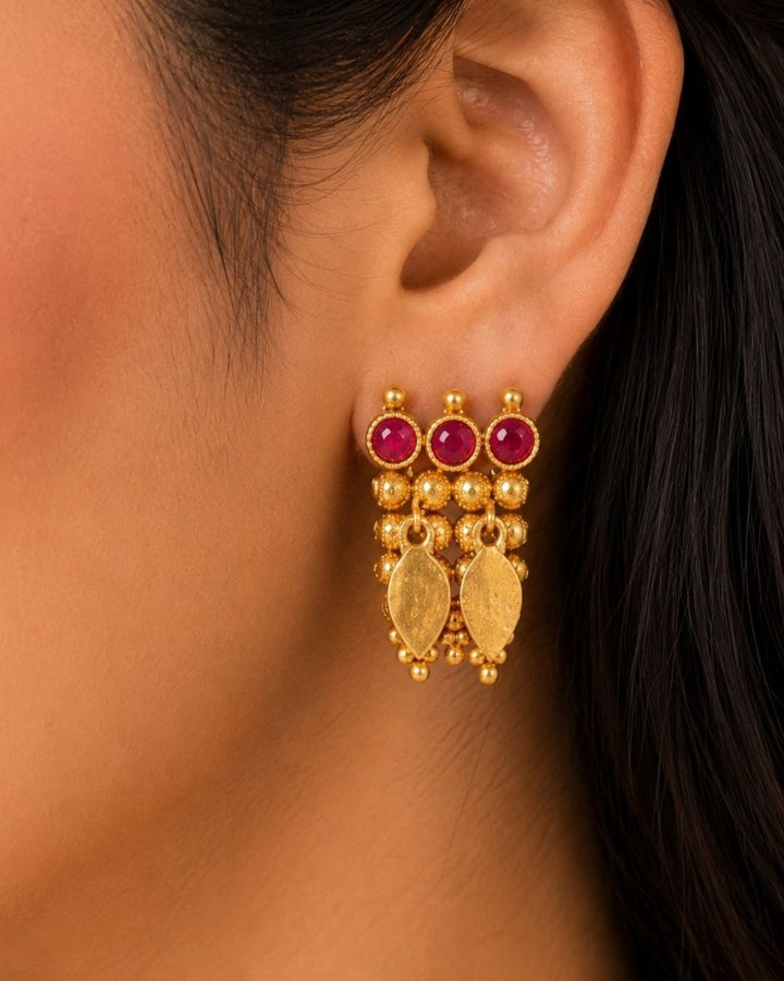 South indian women Beautiful gold plated Kundan choker necklace set featuring a detailed ruby stone border, layered golden beadwork, and elegant hanging motifs, paired with matching earrings. Perfect for festive occasions, traditional wear, weddings, and gifting.