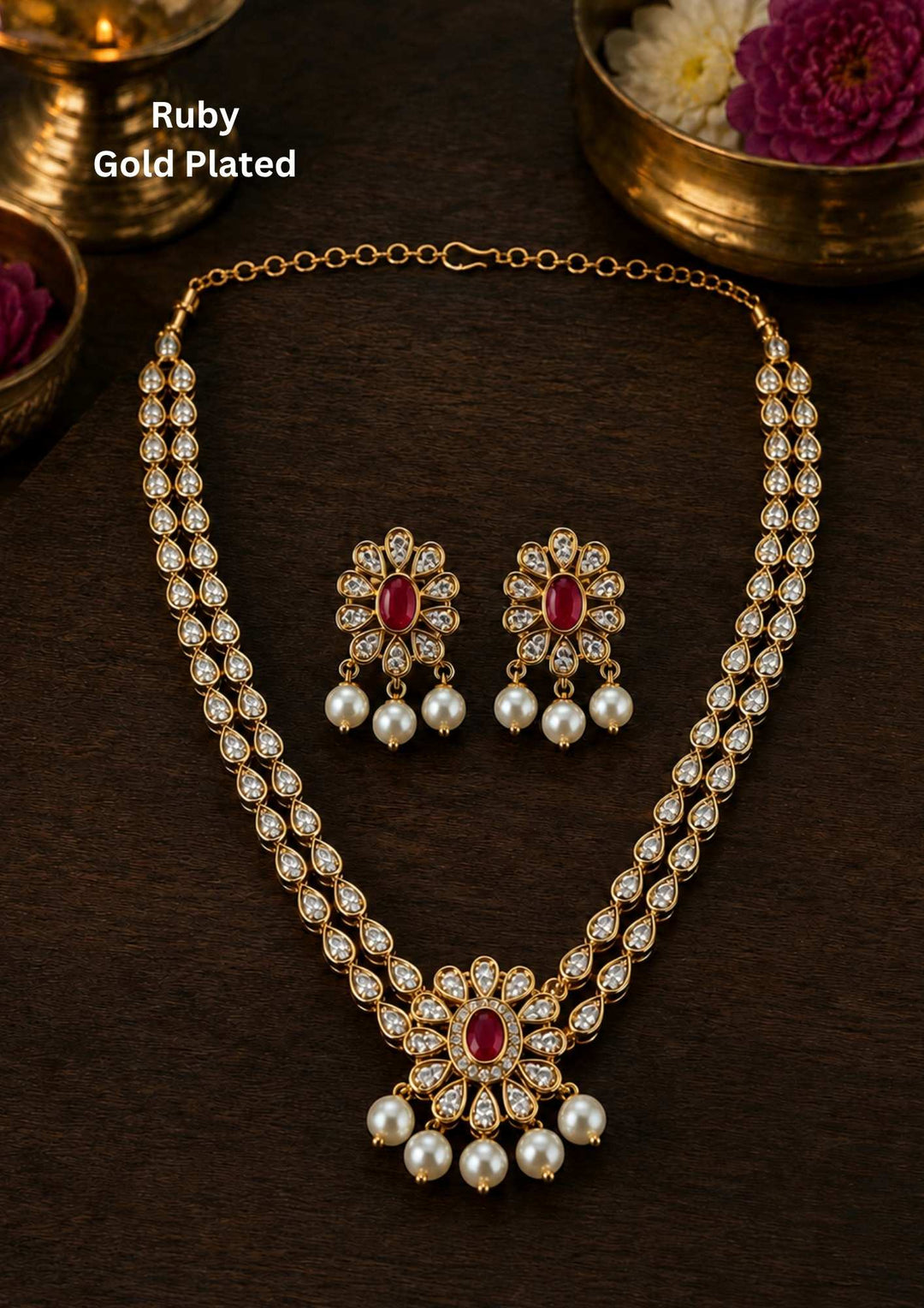 Gold-plated necklace with intricate design necklace and earrings with red (ruby) stones come with necklace and earrings with beads and in pendent shows clear design and in detailed shown in picture it will not fade color and water proof can used for festivals, bridals, and weeding's  