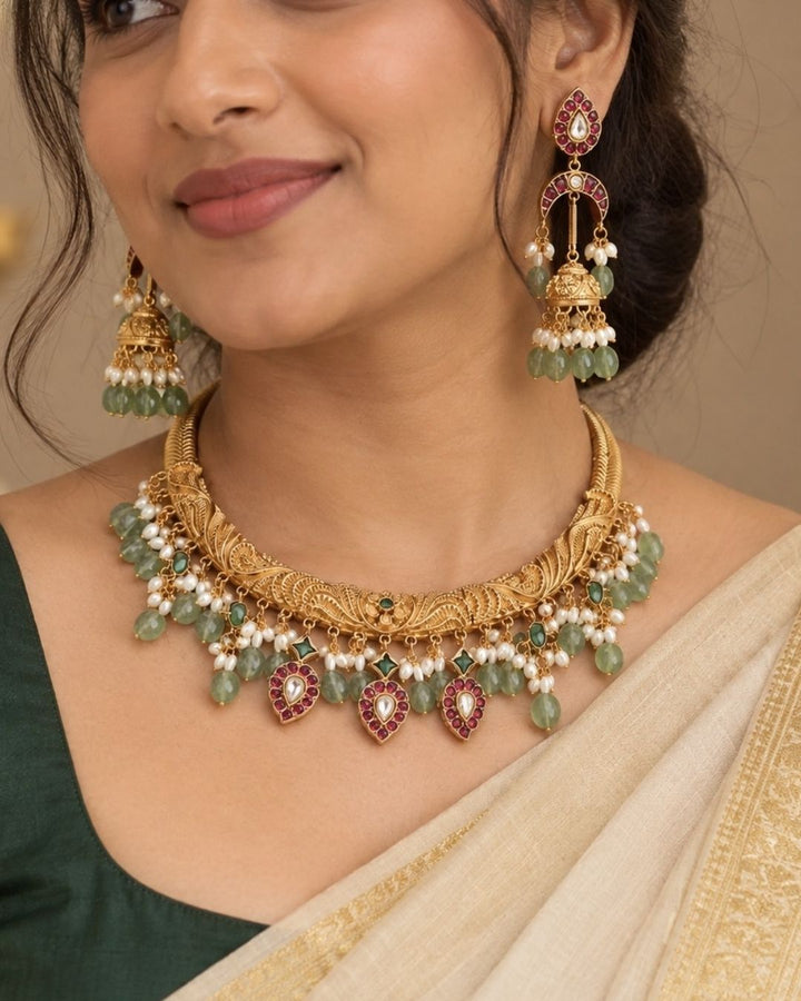 jadau kundan gold-plated necklace and earrings and in image necklace and earrings look very classy and the beads with light weight earrings and can be use for festivals. weeding&