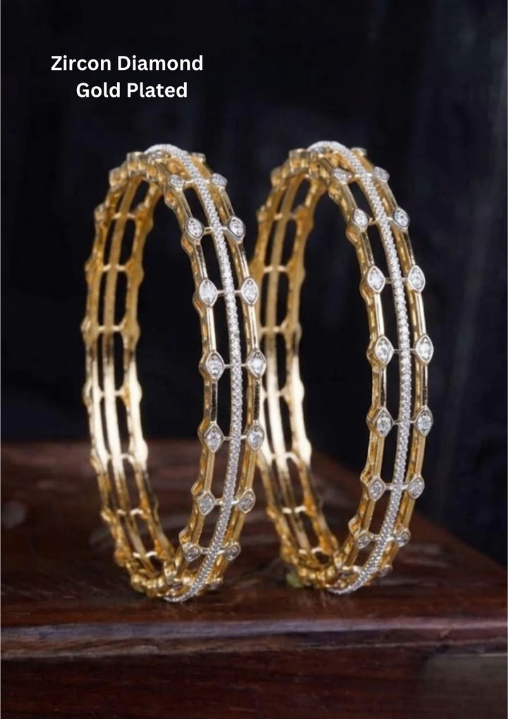 gold plated open-work grid kada bangles. The architectural design features two parallel outer rows of gold connected by delicate vertical bars, highlighted down the center by a solid track of micro-pave pure Zirconian diamonds and accented with diamond-shaped crystal frames along the edges.